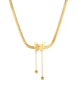 Gold necklace with a heart pendant and hanging beads on a white background