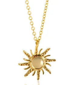 Gold sun-shaped pendant necklace on a white background