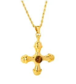 Gold cross necklace with a brown gemstone on a white background