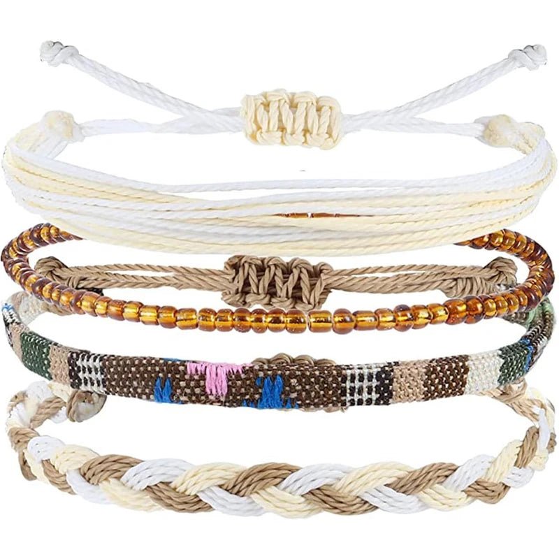 Set of multicolored beaded and braided bracelets on a white background