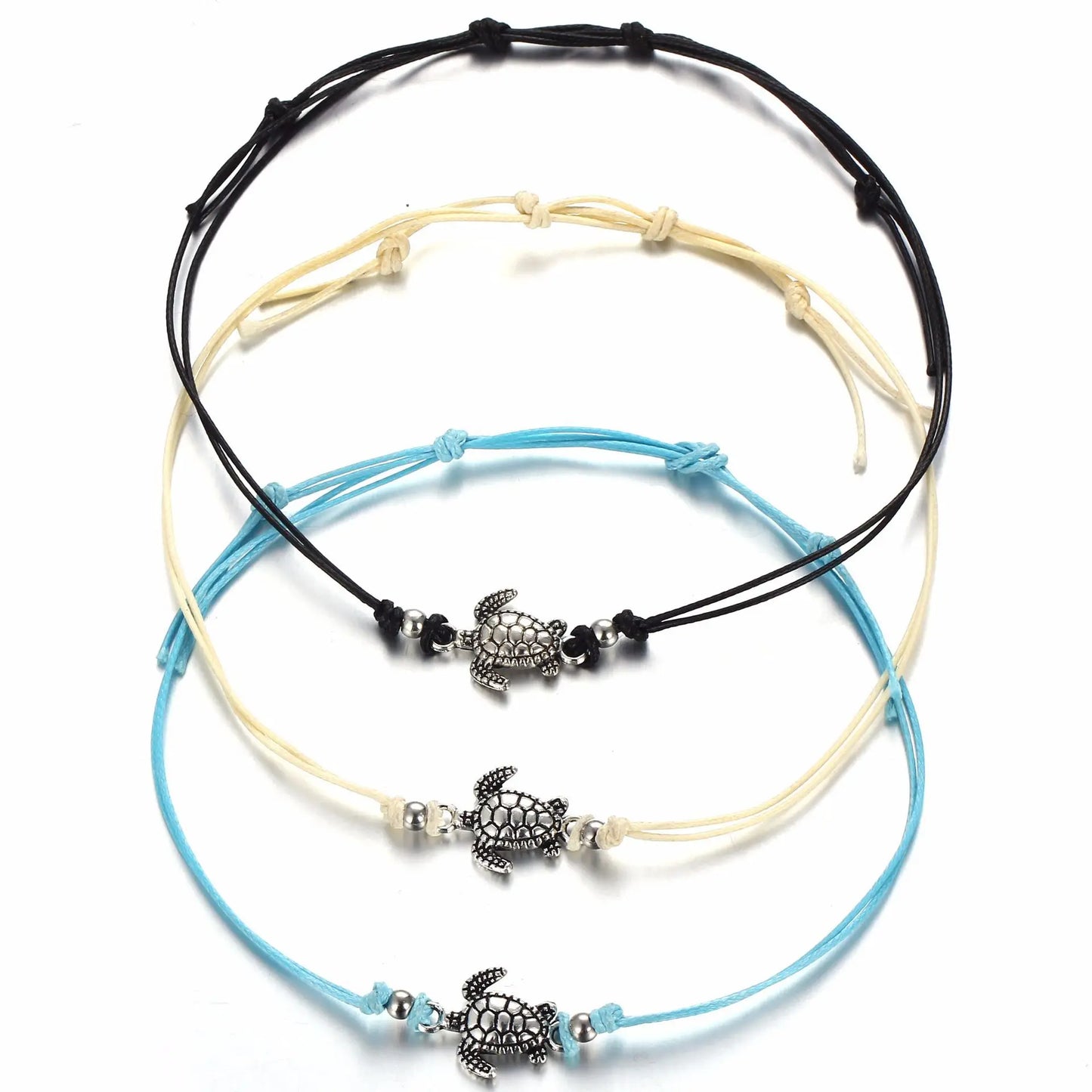Three turtle-themed bracelets on a white background